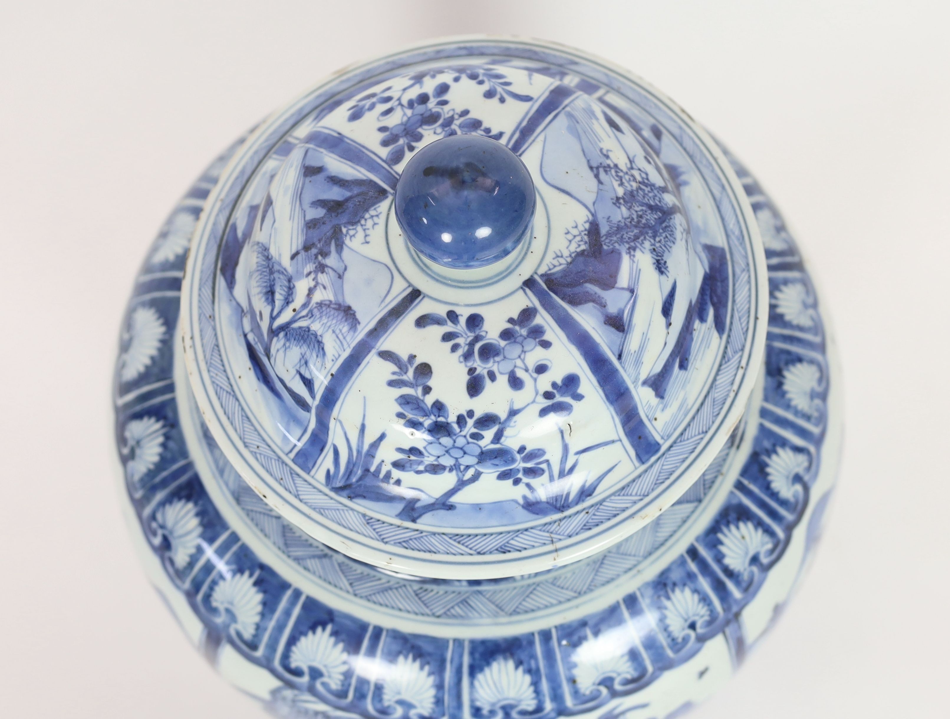 A large Chinese blue and white jar and cover, Kangxi period, 58cm high, Some restored cracks